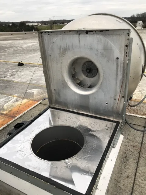 Cambridge hood cleaning technician servicing a commercial kitchen exhaust system
